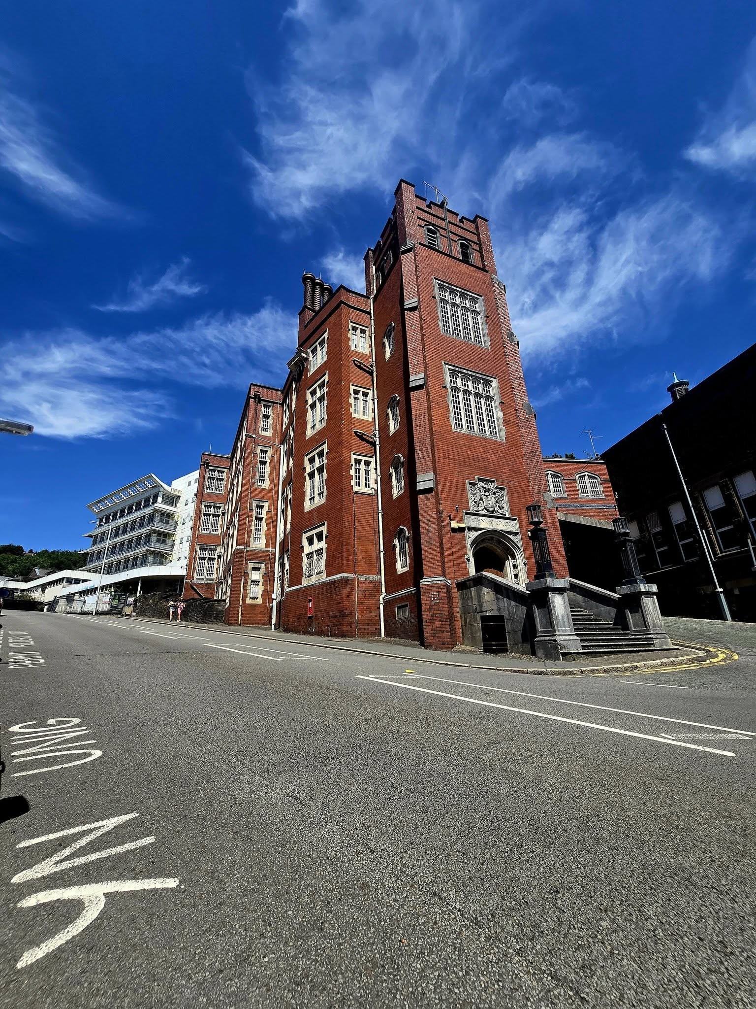 The red-brick former Technical College building on its Mount Pleasant street corner under blue sky