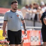 Pure Swansea manager Jack Midwinter watching from the touchline in a white training top