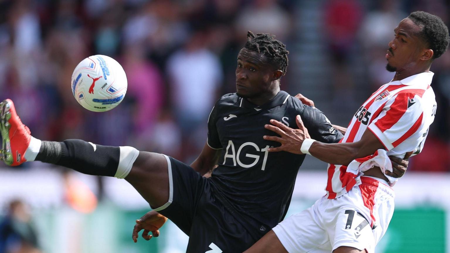 Swansea City winger Joseph Opoku in action