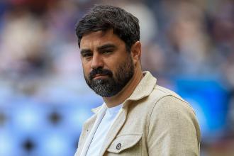 Swansea City head coach Vitor Matos on the touchline during a match