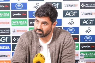 Swansea City head coach Vitor Matos speaking at a press conference