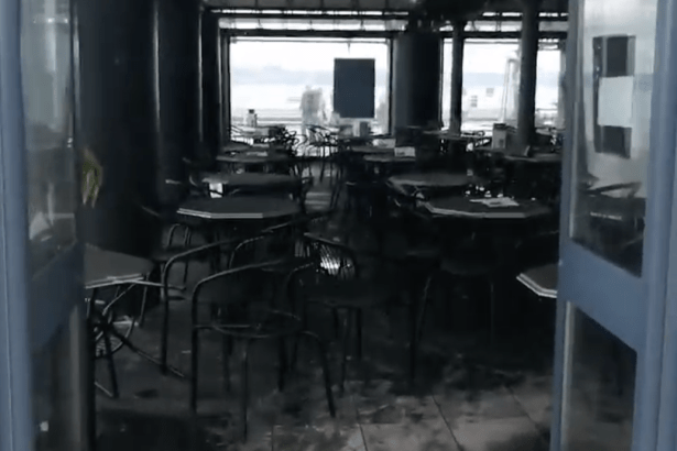 The blackened fire-damaged interior of Verdi's in Mumbles