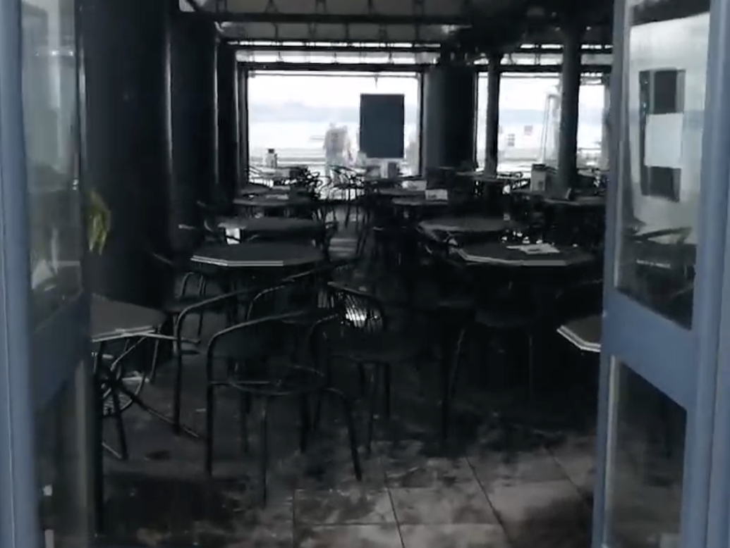 The blackened fire-damaged interior of Verdi's in Mumbles
