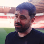 Vitor Matos speaking pitchside at the bet365 Stadium after Swansea City's win