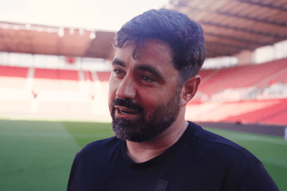 Vitor Matos speaking pitchside at the bet365 Stadium after Swansea City's win