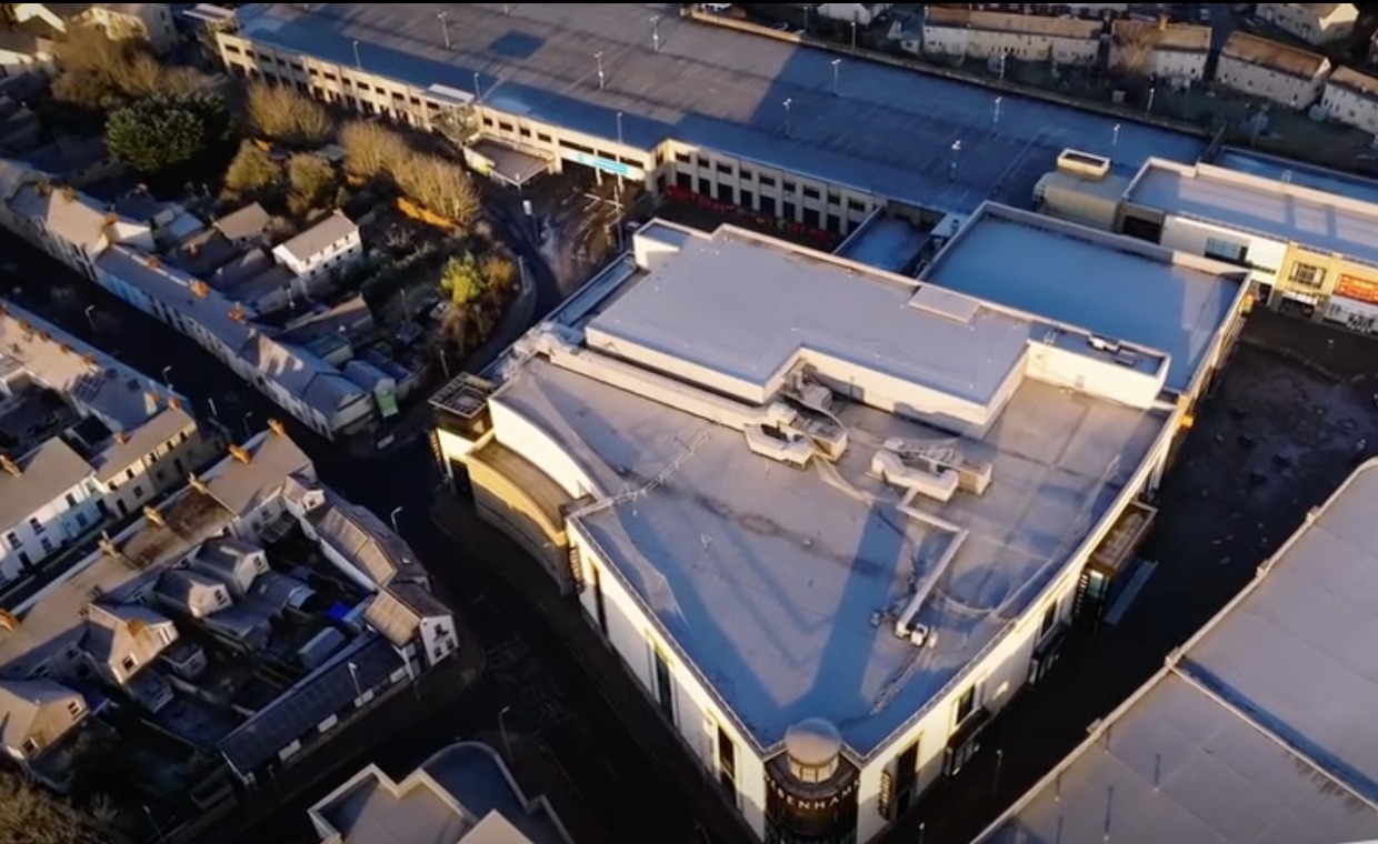 Aerial drone view of the former Debenhams building's flat roof in Carmarthen town centre