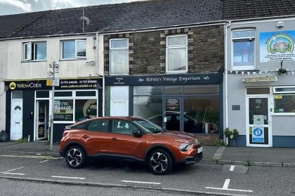 The former Kirstie's Vintage Emporium shopfront on Gorseinon High Street between the Yellow Cabs taxi office and Noah's Ark daycare