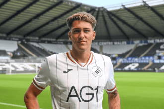 Tiago Parente in a Swansea City home shirt on the pitch at the Swansea.com Stadium