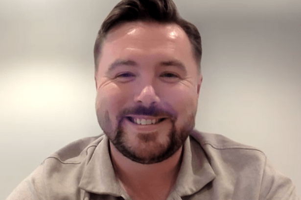 Jack Midwinter, manager of Pure Swansea FC, smiling in a head-and-shoulders portrait