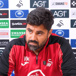 Swansea City head coach Vitor Matos speaking at a press conference