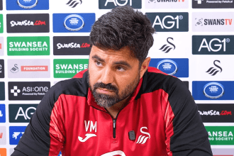 Swansea City head coach Vitor Matos speaking at a press conference