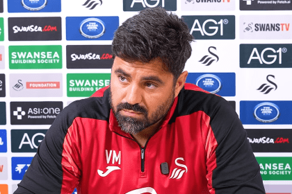 Swansea City head coach Vitor Matos speaking at a press conference