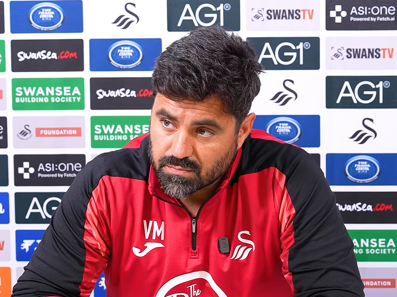 Swansea City head coach Vitor Matos speaking at a press conference