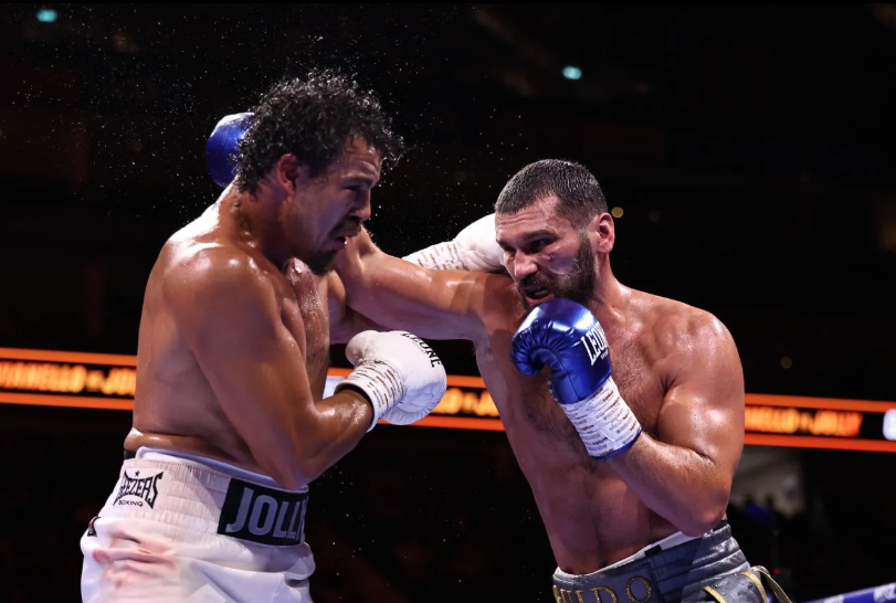 Moses Jolly and Guido Vianello exchanging punches in the ring at the O2 Arena