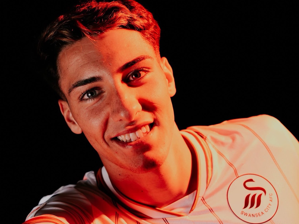 Swansea City new signing Tiago Parente in the new home shirt, with the circular club badge showing the Swansea City AFC lettering