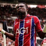 Swansea City winger Joseph Opoku with arms outstretched during the game at Derby County