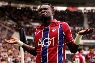 Swansea City winger Joseph Opoku with arms outstretched during the game at Derby County