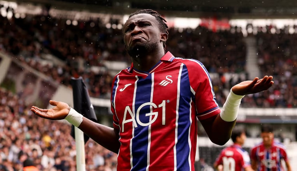 Swansea City winger Joseph Opoku with arms outstretched during the game at Derby County