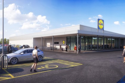 A computer generated image of a modern Lidl supermarket with glass frontage, car park and Lidl sign