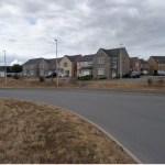 A row of new stone and render houses on the Maes Pedr estate in Carmarthen West