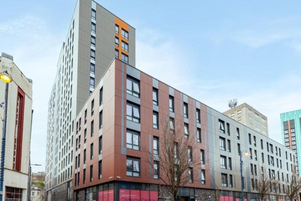 The Oldway Centre student block on High Street, Swansea, with its tower rising behind the lower High Street extension