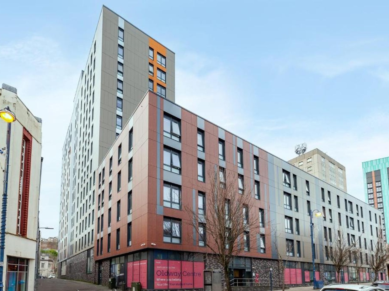 The Oldway Centre student block on High Street, Swansea, with its tower rising behind the lower High Street extension