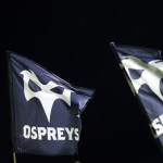 Ospreys players during a match, in the club's home colours
