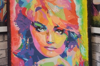 Ian Hendry's pop art portrait of Bonnie Tyler in bright blocks of colour, close-up of the face