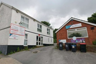 The vacant white two-storey building at 120 Gower Road in Sketty beside the red-brick Tawe Veterinary Group practice