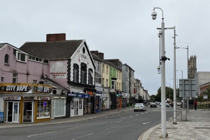 St Helen's Road in Swansea looking along the row of shops from the City Vape corner