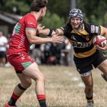 Community rugby players contest the ball during a club match in Wales