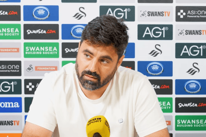 Swansea City head coach Vitor Matos speaking at a press conference