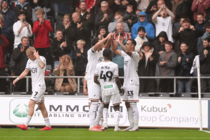 Swansea City in action against Burnley at the Swansea.com Stadium