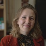 Jeanne Audren de Kerdrel, French and Spanish teacher at Ysgol Gymraeg Ystalyfera Bro Dur, smiling in a classroom in the S4C series Athrawon