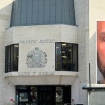 Composite image of Swansea Crown Court with an inset South Wales Police custody photograph of Christopher Barnett