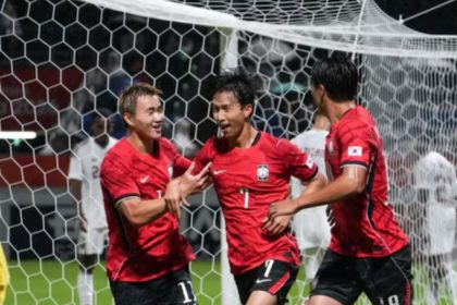 Swansea City winger Eom Ji-sung celebrates a goal for South Korea