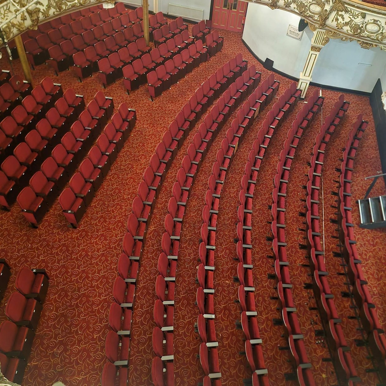 The completed rows of new red seats in the stalls at Swansea Grand Theatre seen from above