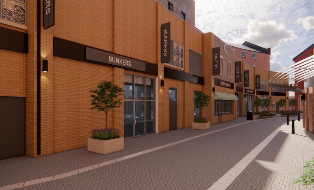 Architect's render of Little Wind Street looking towards a corner bar, with new signage panels, wall-mounted lights and planters along cleaned brick facades