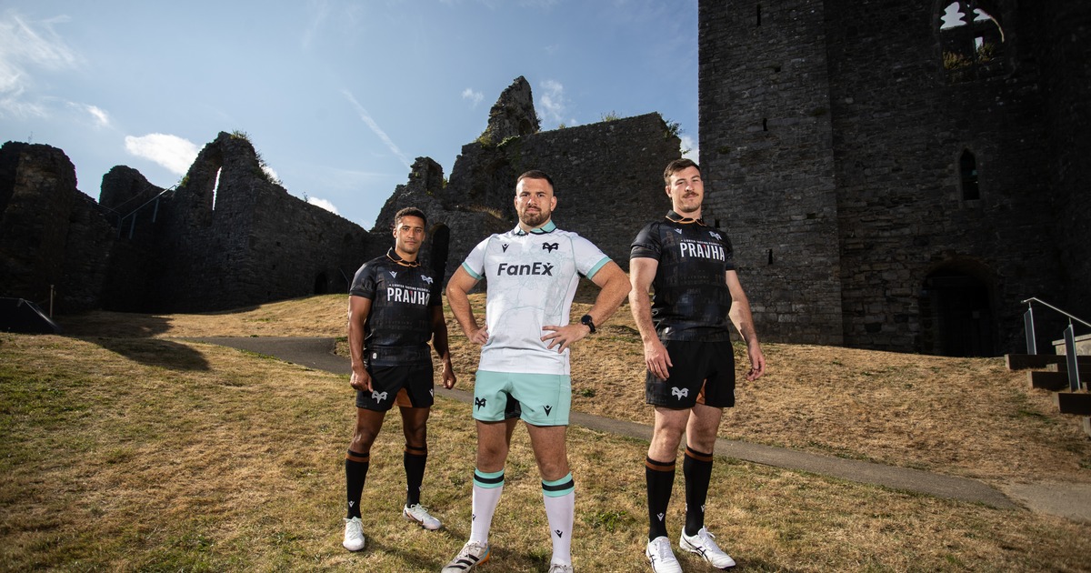 Three Ospreys players in the new 2026/27 kits, two in the black home shirt and one in the white and teal away shirt, at a ruined castle