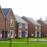 A row of new red brick council houses with solar panels on the roof at Parc Pendre in Kidwelly