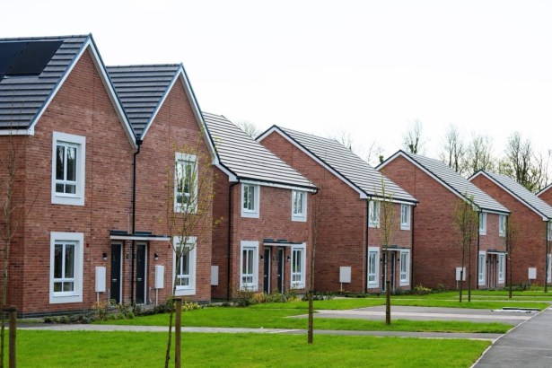 A row of new red brick council houses with solar panels on the roof at Parc Pendre in Kidwelly