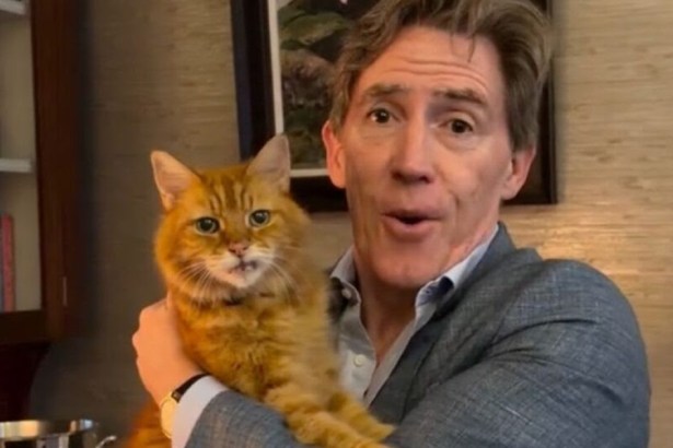 Rob Brydon holding his ginger cat Crumble as he announces his children's book The Cat In The Cupboard