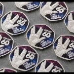 Two Star Trek 60th anniversary 50p coins, one with the Vulcan salute and Live Long & Prosper, one with four starships against a colour nebula