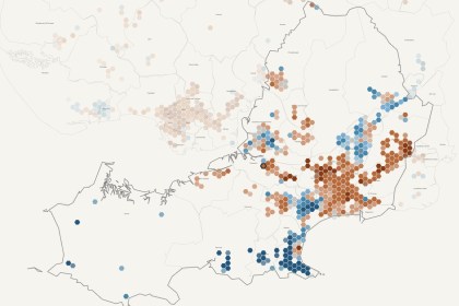 Hexagon map of Swansea county showing house prices rising in orange across the city centre and east, and falling in blue along the Mumbles and Gower coast