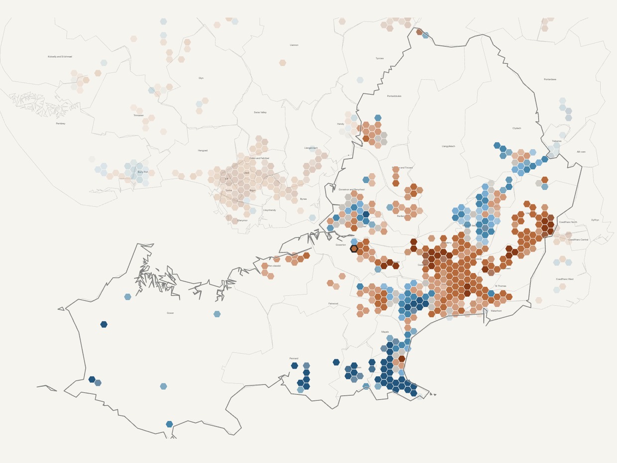 Hexagon map of Swansea county showing house prices rising in orange across the city centre and east, and falling in blue along the Mumbles and Gower coast