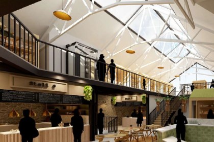 Artist's impression of a revamped Tenby Market Hall with food stalls, cafe seating and a first-floor mezzanine beneath a glazed roof