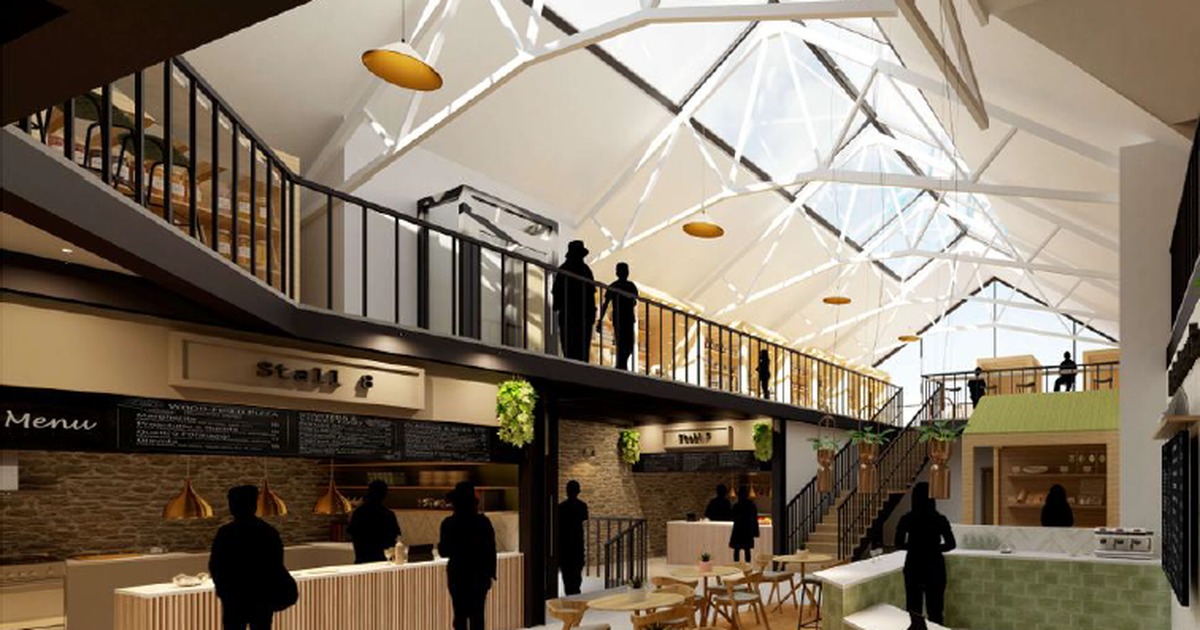 Artist's impression of a revamped Tenby Market Hall with food stalls, cafe seating and a first-floor mezzanine beneath a glazed roof