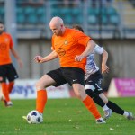 Pure Swansea centre-half Ollie Roberts in the club's orange kit