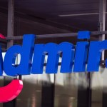 The blue Admiral sign with its pink swoosh on the front of an Admiral office