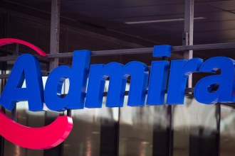 The blue Admiral sign with its pink swoosh on the front of an Admiral office
